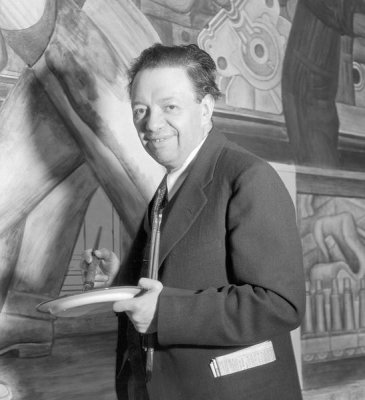 photographer unknown - Diego Rivera posed while working on the North Wall of his Detroit Industry murals at the DIA, 1933